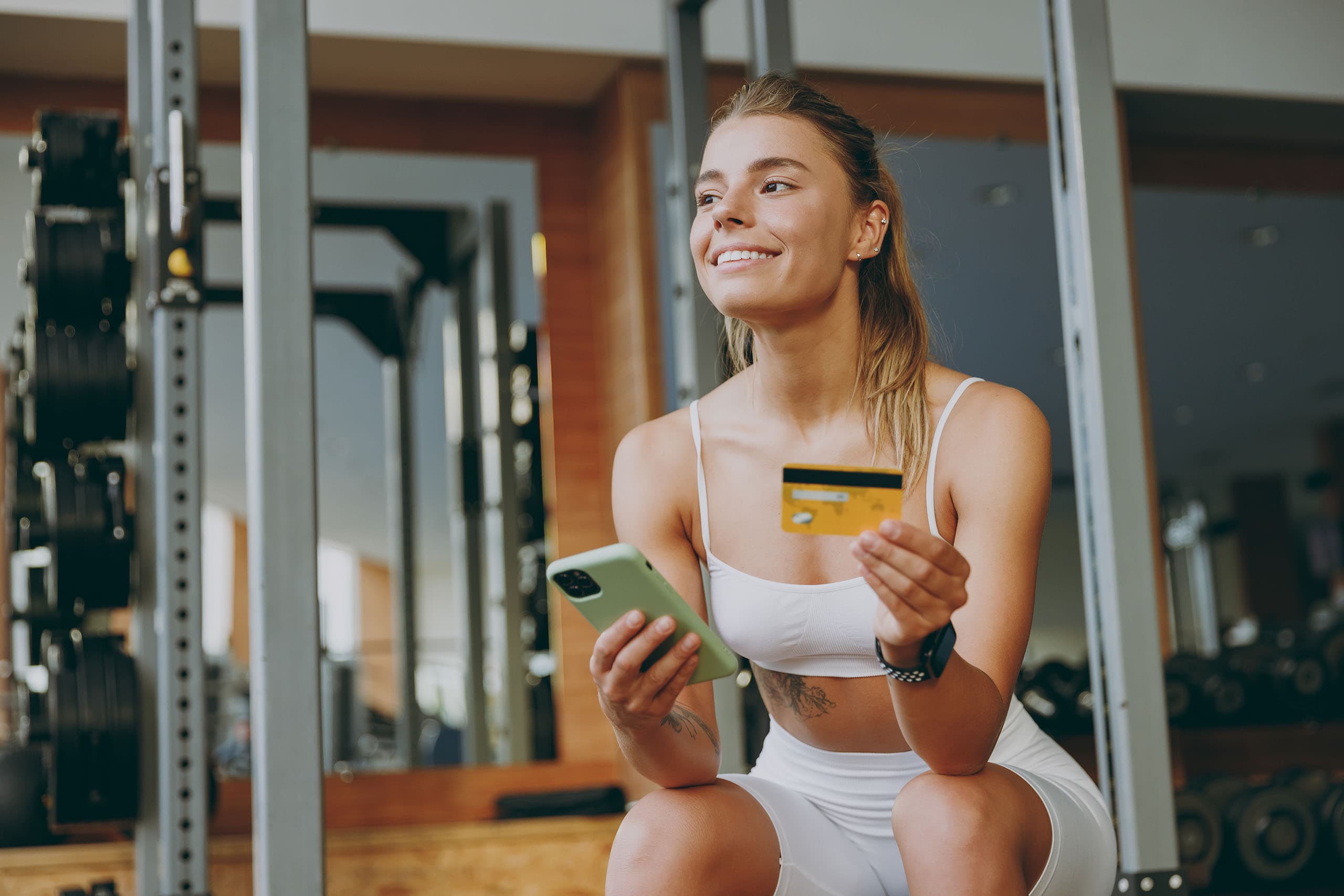 a person completing their membership payment at the gym