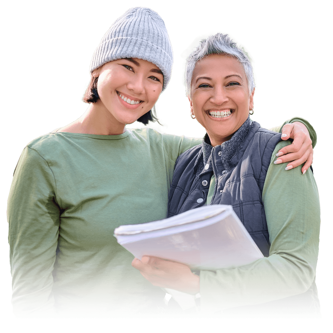 Two women standing together and smiling.