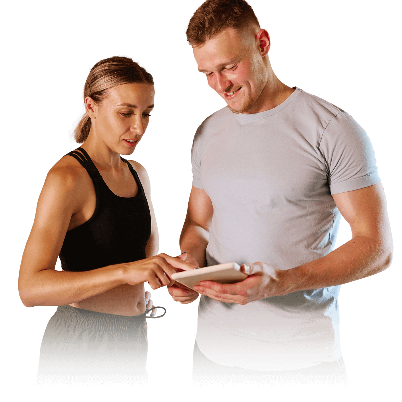 A man in a gray t-shirt and a woman in a black top looking at a tablet together.