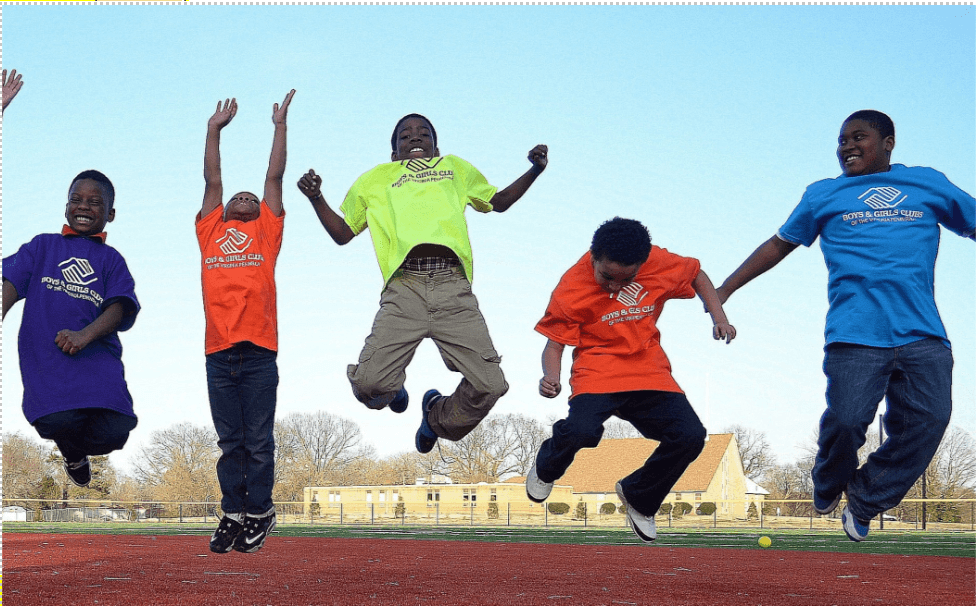 kids jumping at a field