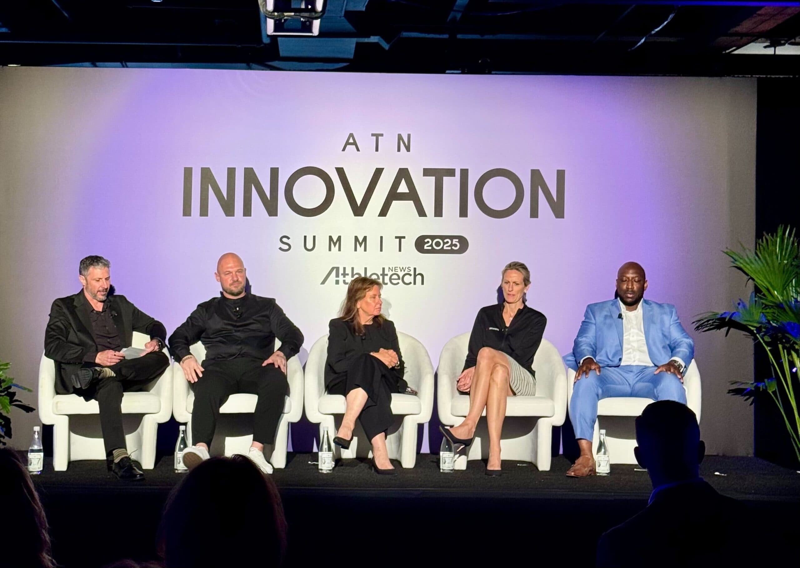 Fitness professionals discussing AI tools at an industry summit