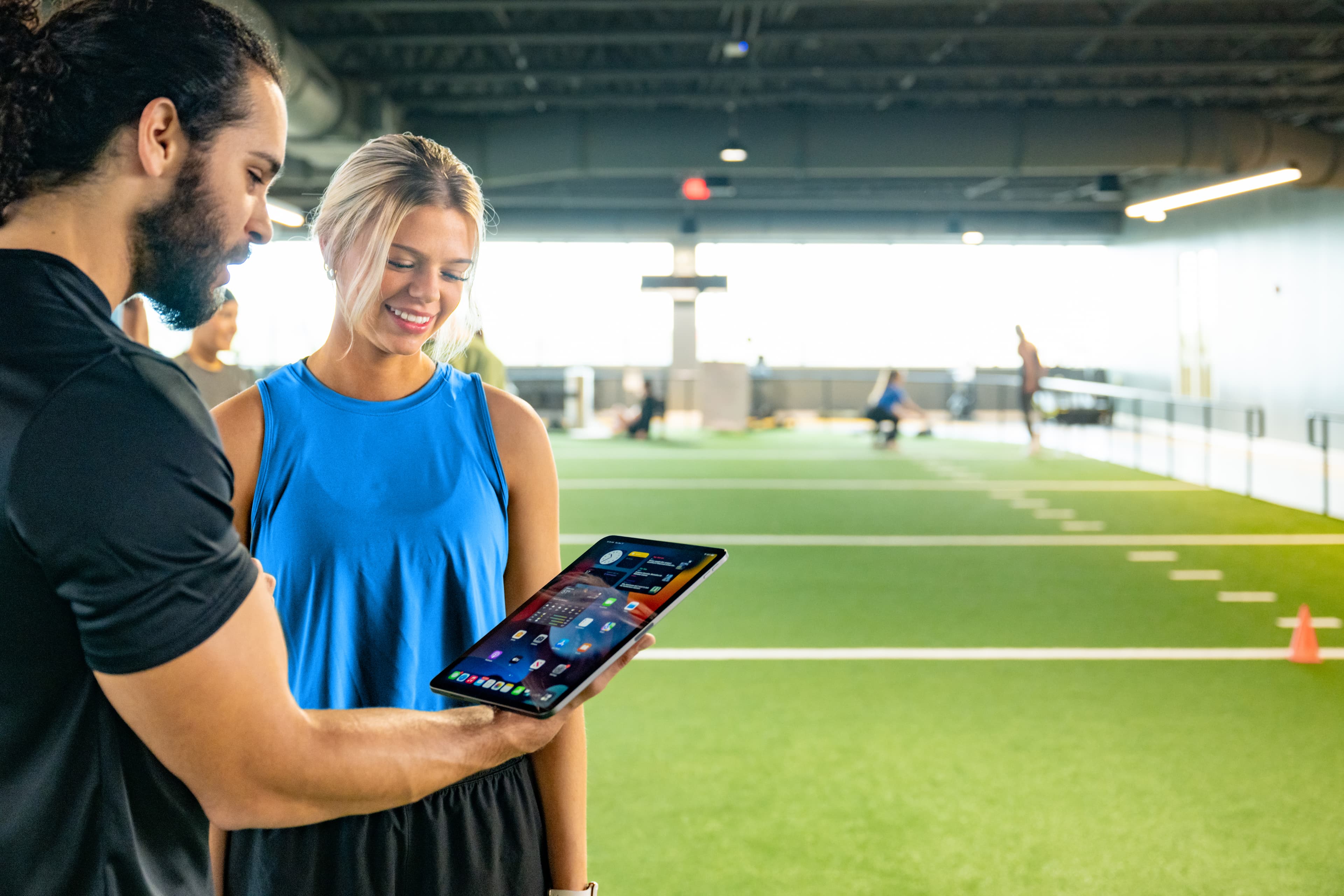 Member checking in at a self-service kiosk at a community facility
